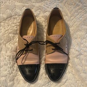 The Office of Angela Scott

Pink and Tan Flats with Classic Oxford Design